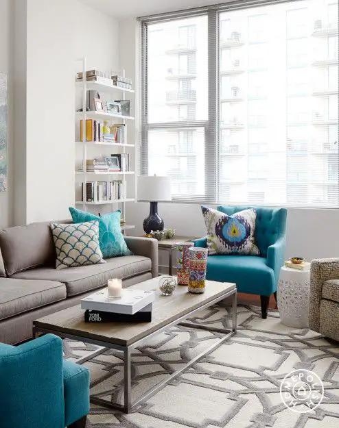 A Bold, Rental-Friendly Redesign in Chicago - The strong patterned area rug from <a href="http://www.horchow.com/Global-Views-Gray-Abstract-Rug-Silver-Gray/cprod89510101_cat15320731__/p.prod?icid=: 