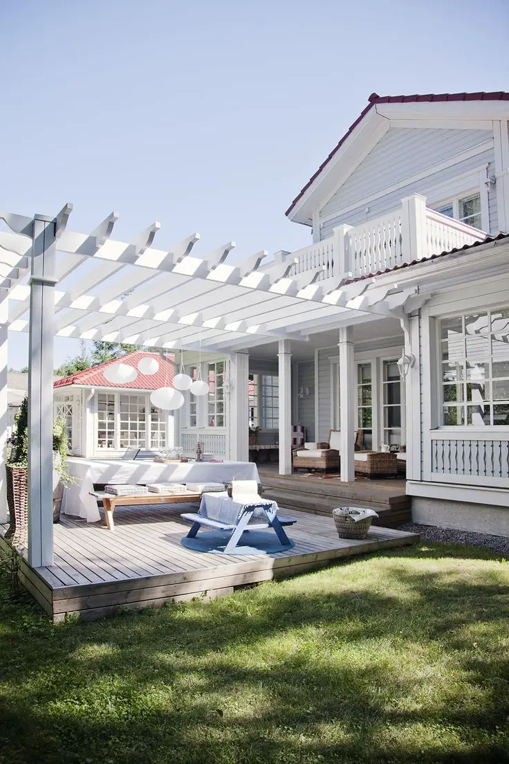 WOW! I love the nook to the back left, the pergola for shade (And hanging plants) and the cozy feel this deck has!
