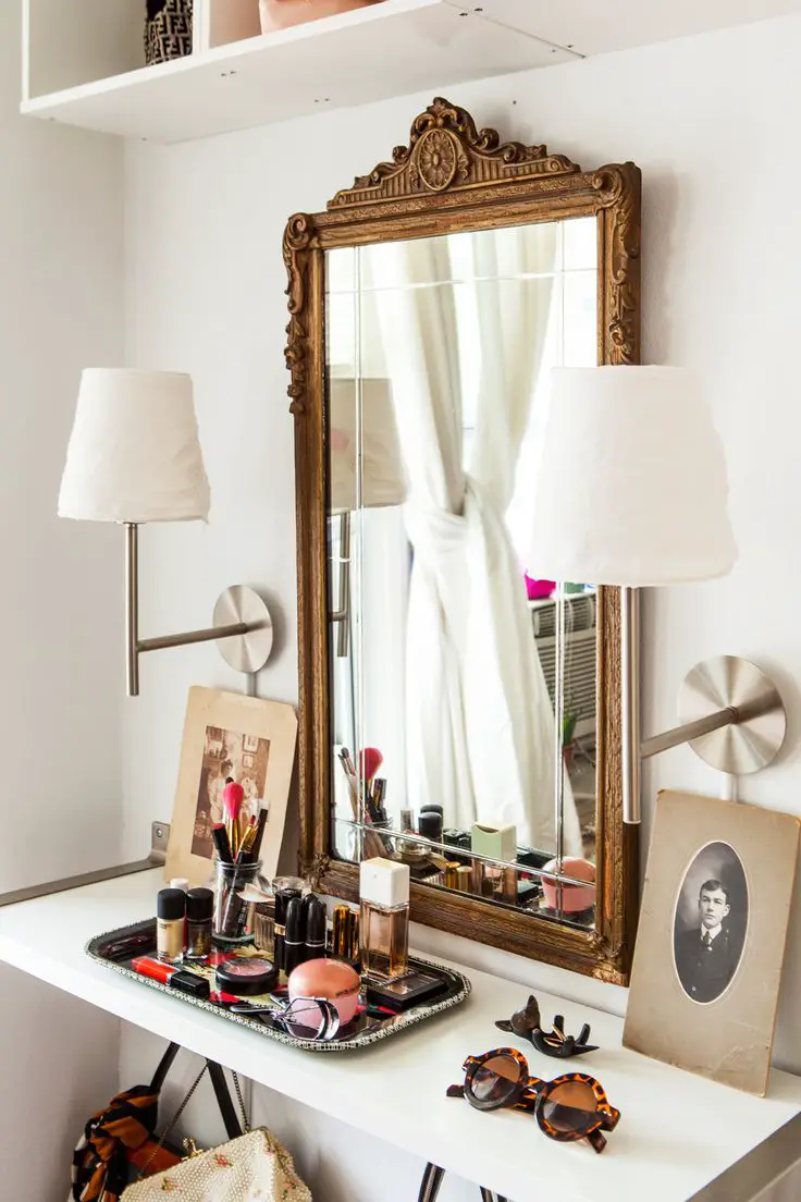 The IKEA Home Tour Squad created a small-space vanity for Chloe Daley of #refinery29 using wall shelves and lamps from IKEA, together with Chloe's antique mirror.