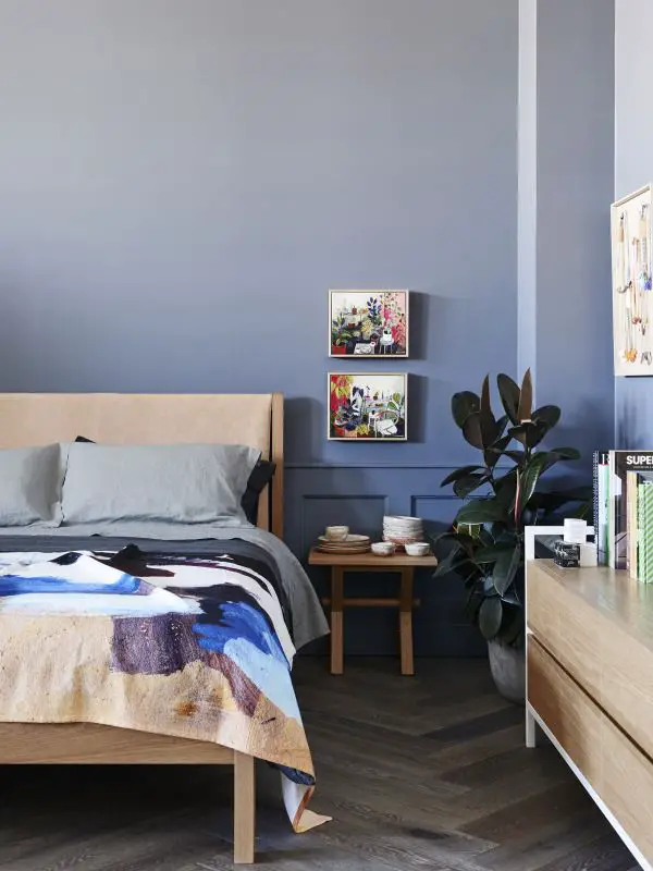 Bedroom details.   All furniture by Jardan. Paintings above right hand bedside by Elizabeth Barnett. Ceramics on bedside by Sarah Schembri. Artwork on right hand wall by Kirra Jamison.  Bedlinen by Frank and Mint, throw by Shilo Engelbrecht.  Flooring – French Grey Herringbone by Royal Oak Floors.  Wall colour – Dulux Mirage Blue. Photo – Eve Wilson.