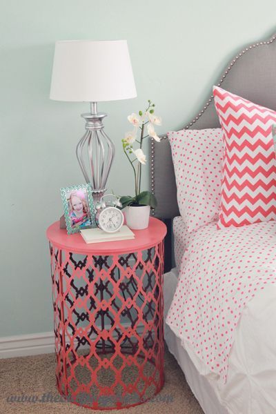 Painted trash can turned over as side table.  I would use outdoor paint, for outdoor table.