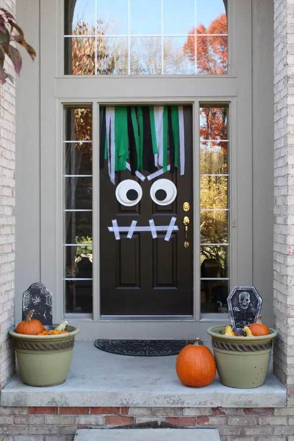 The Best 35 Front Door Decors For This Year’s Halloween - Opt for something fun and simple and turn your front door into a cute yet scary monster. Use two plates for the eyes and tape for the mouth.{found on moderndaymoms}.: 