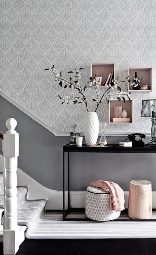 Team a patterned wallpaper in a soft shade with a darker toning paint colour for a hallway with impact. Box shelving is an easy and stylish storage solution. Photography: Mark Scott