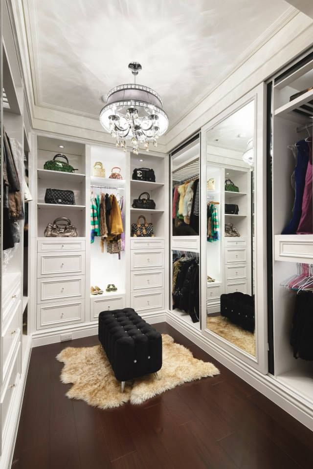 Lovely white walk-in closet with a mirror doors. Home ideas at: http://www.homechanneltv.com/