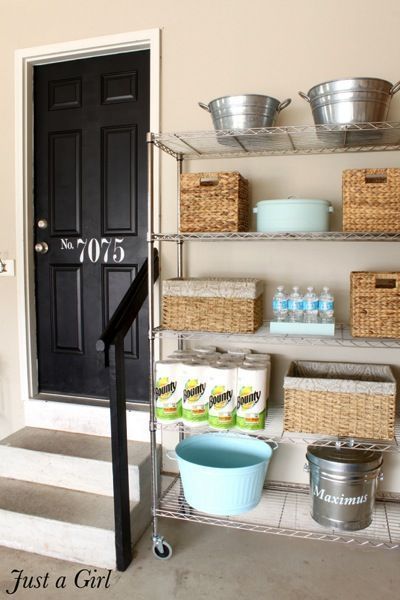 Roundup: 6 Inspiring Impromptu Garage Mudrooms » Curbly | DIY Design Community Like the stenciled door! AND the storage space