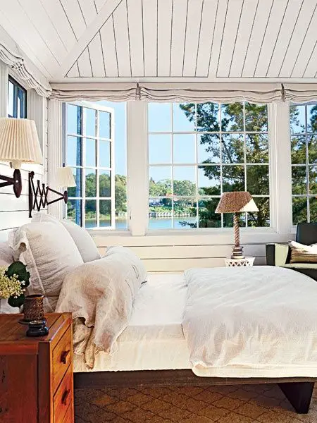 Lovely Lake House Sunroom decorated in blue and white via  @krinze