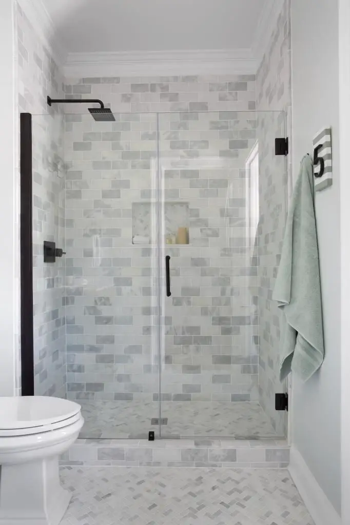 Bathroom using Cream Herringbone bathroom floor tile. https://www.pebbletileshop.com/products/Cream-Herringbone-Stone-Mosaic-Tile.html#.VVzyjflViko