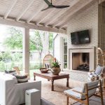 covered-patio-sloped-ceiling-hanging-rattan-chairs