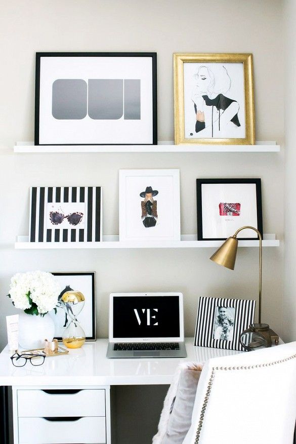 Leaning, feminine art in work space with various frames: 