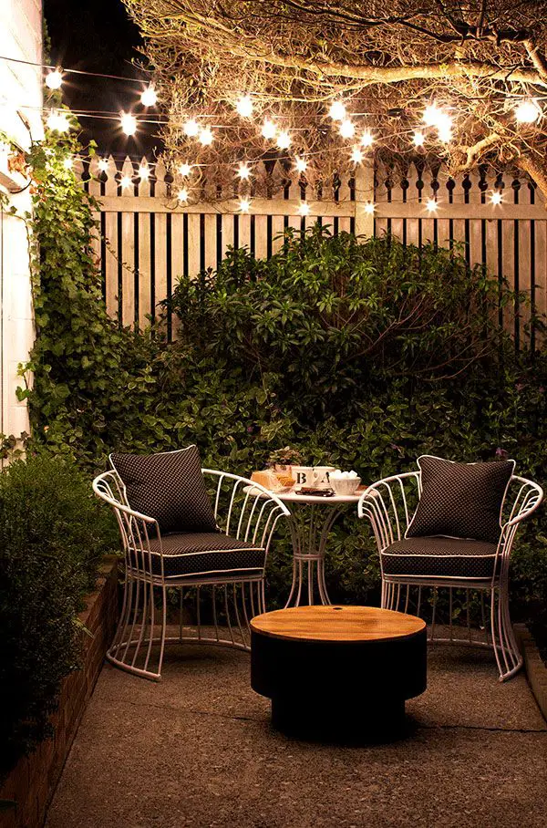 The outdoor string lights add the magic to this cozy small patio created by Aileen Allen, who writes At Home in Love. She has some terrific outdoor decorating ideas for renters or anyone with a small outdoor space. See more at The Home Depot Blog. || @aileenallen