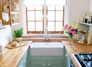 I LOVE IT ALL!! horseshoe small kitchen layout with aqua cabinets and wood countertops via House to Home