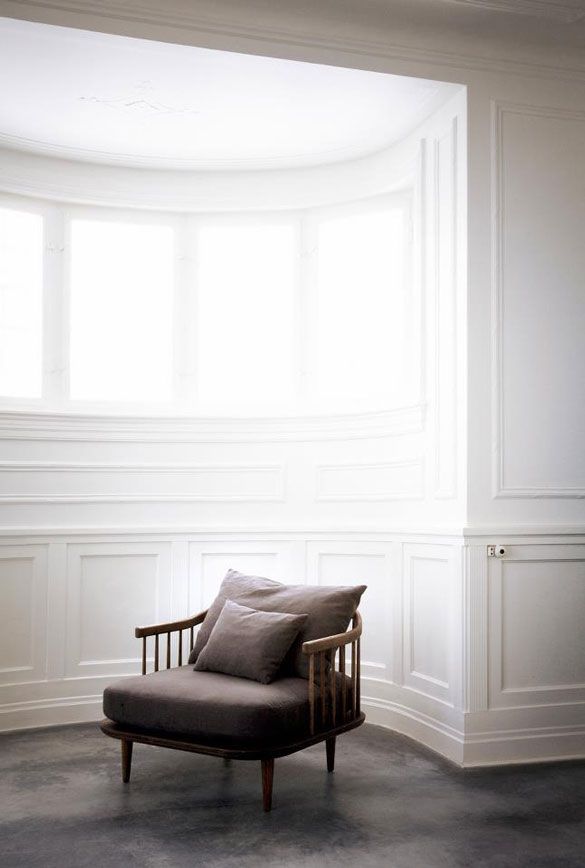 white room with arm chair