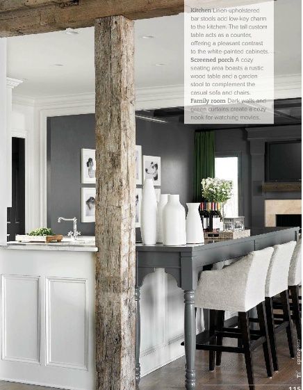 Rustic modern kitchen. grey + white + linen. Love the idea to extend kitchen counter to make a breakfast bar by adding a table pushed up to the counter.  And those bar stools actually look comfortable.