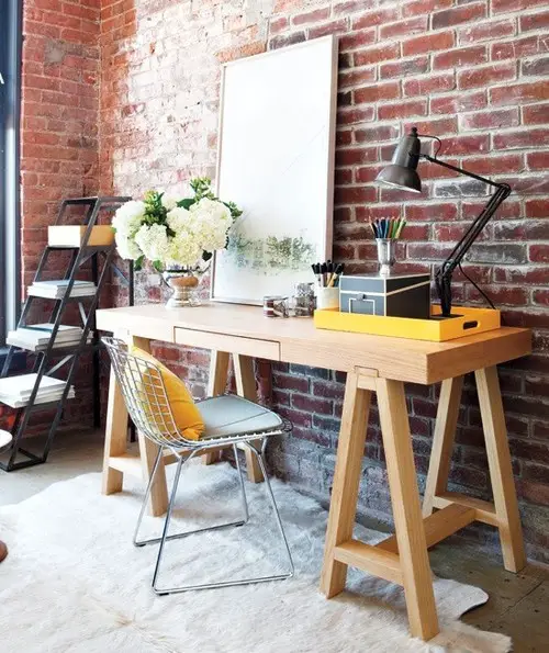 loft like office space design. Love that exposed brick wall.