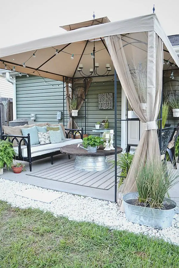 Back patio makeover- use thrifted items to make a space beautiful. You do not have to spend a lot of money to make your space beautiful!