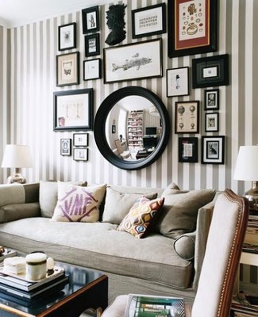 Linen covered sofa - Striped wallpaper - Gallery wall in black, white, and browns