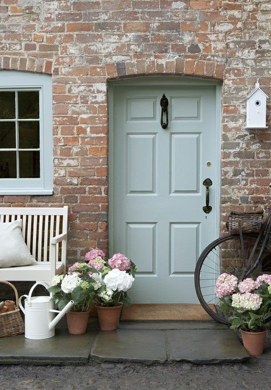 This color palette projects a warm and hospitable home just beyond this door.