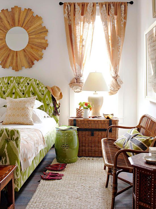 This room has a gorgeous tropical feel. The trunk, the rattan, the bedding, the wood mirror, and the sheer drapes all have that vacation feeling!