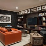 modern-small-man-cave-ideas-orange-leather-sofa-open-shelves