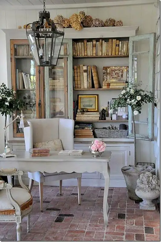 Cottage Chic - Design Chic, shabby chic home ideas, french country looking home, dried hydrangeas, light blue bookcases, vintage book display ideas, lantern over desk
