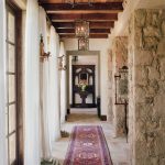 gorgeous-farmhouse-hallway-with-lots-of-natural-wood-and-stone-750×930