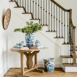 oval-accent-table-next-to-staircase