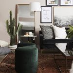 Couch with chair, lamp, cactus and pictures