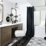 Bathroom with bath tub and black curtains