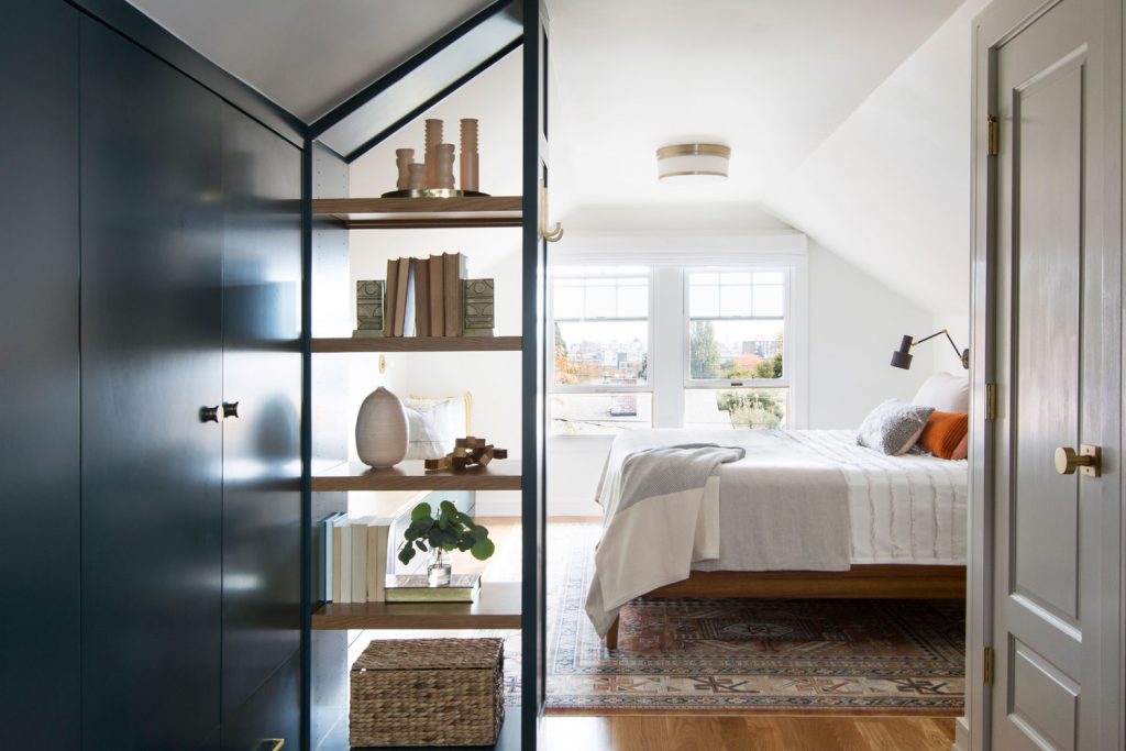 Bedroom with book shelf and vases