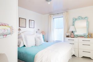 Bedroom with a bed and window with curtains