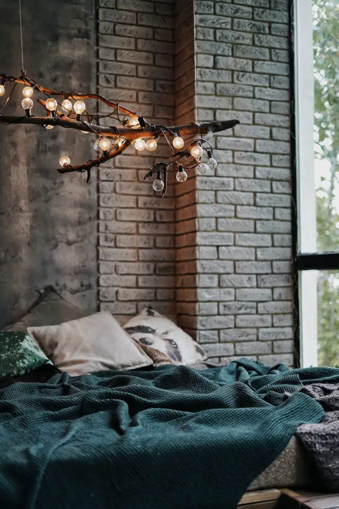 Bedroom with designed lights above the bed