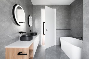Bathroom with tub and mirrors 