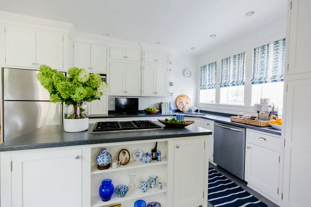 Decorated kitchen with vases and flowers in the kitchen island