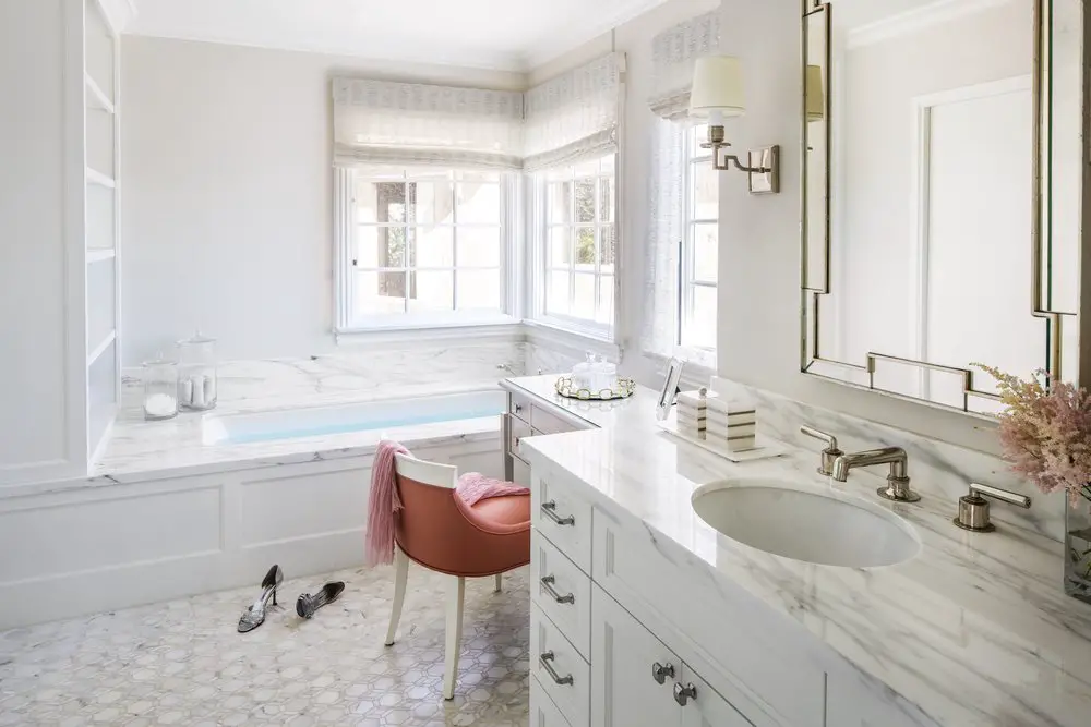 Master bathroom with orange and white sink and mirror 