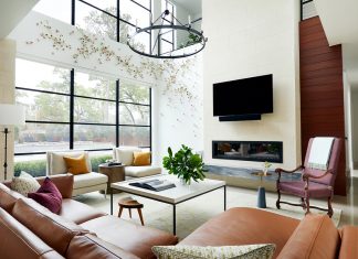 Living room with big windows, sofa, coffee table and TV