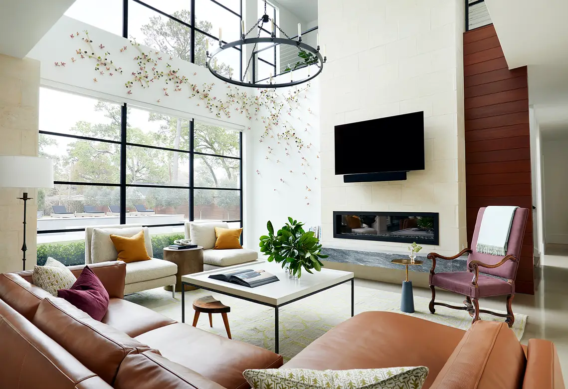 Living room with big windows, sofa, coffee table and TV