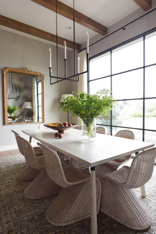 Dining room with big windows, table and chairs