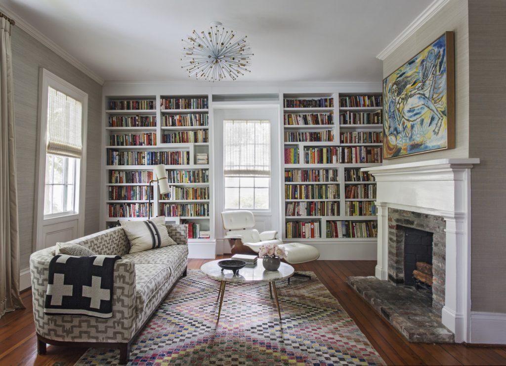 Room with library, sofa, coffee table and firework