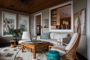 Lounge room with double armchair, armchairs, coffee table and carpet