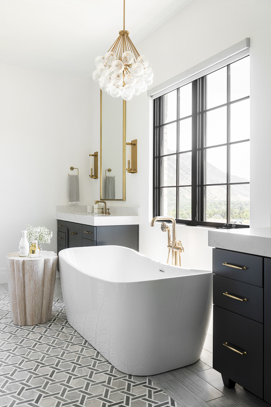 Bathroom with suspended lights and bath tub