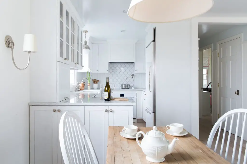 White-designed kitchen and dining room