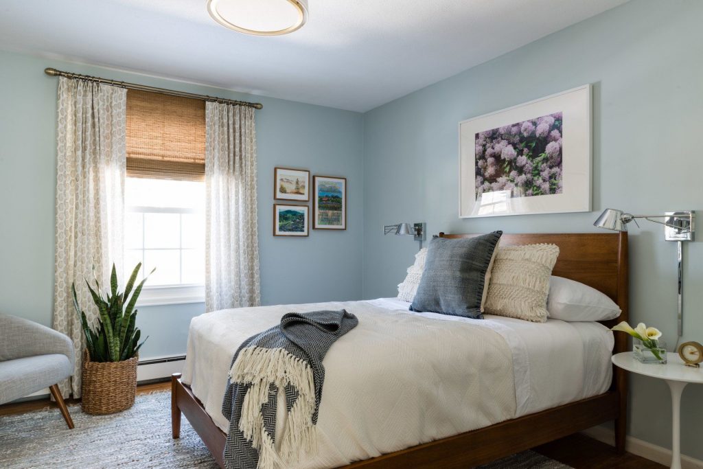 Bedroom with blue walls and double bed