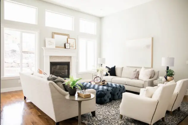 Living room with white armchairs and sofa