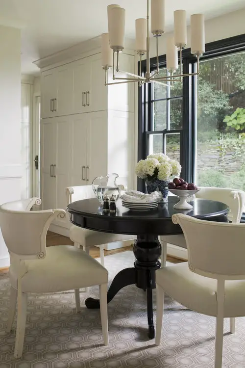 Dining room with black table and white chairs