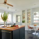 Kitchen and dining room designed in bright and dark colors