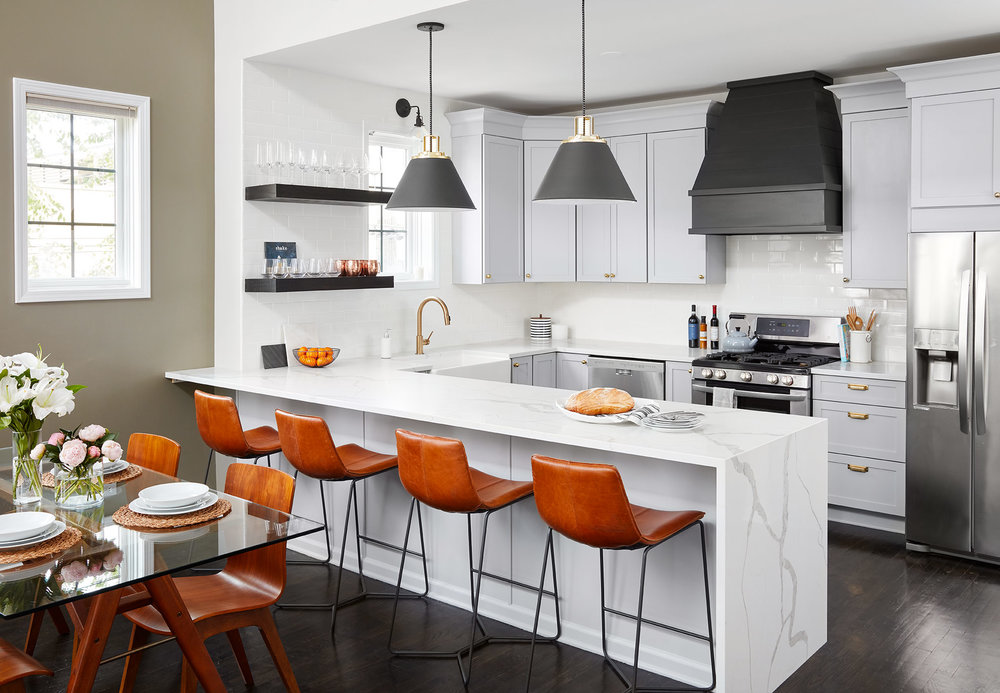 Kitchen with kitchen island and bar chairs