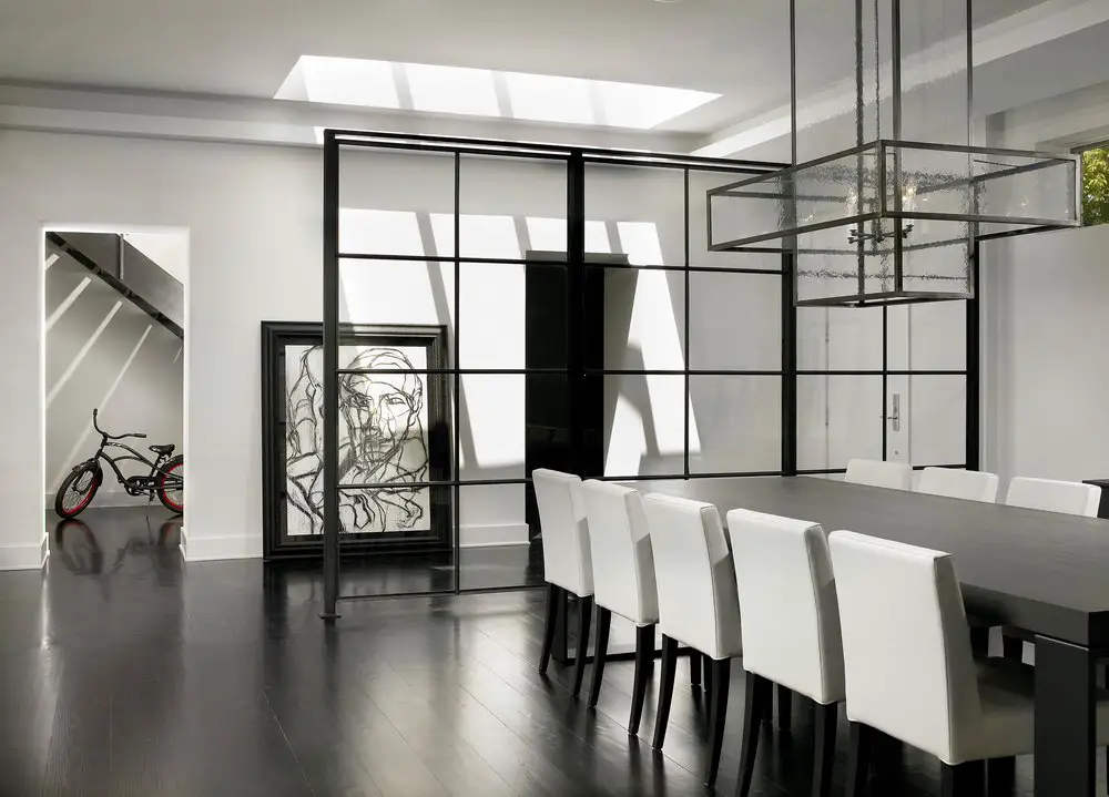 Designed basement dining space with table, chairs and celling