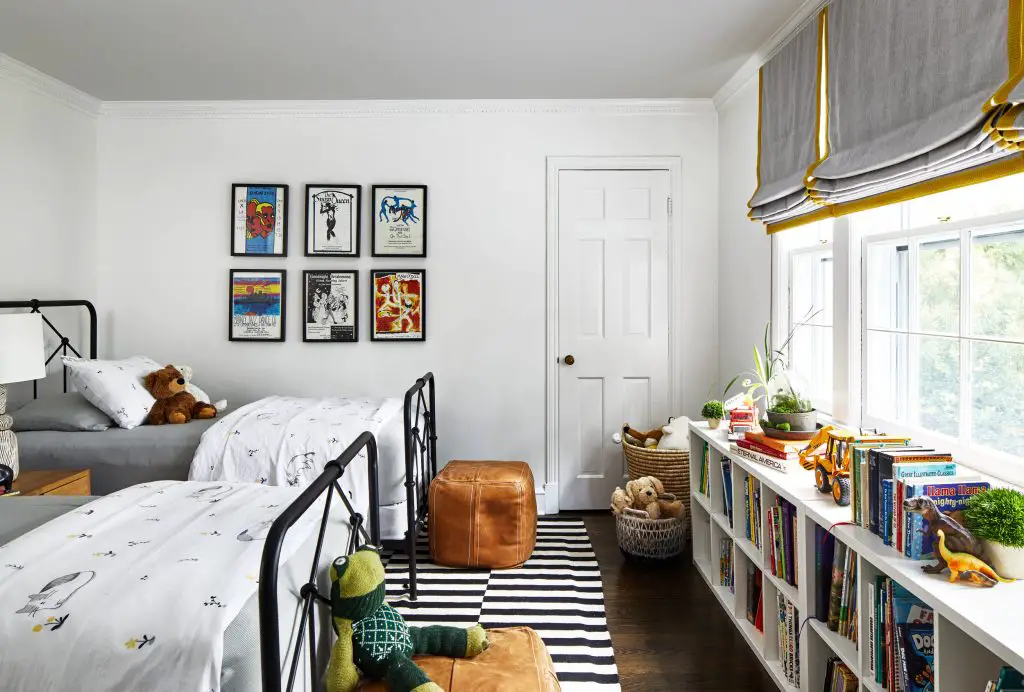 Kids room with two beds and book shelf