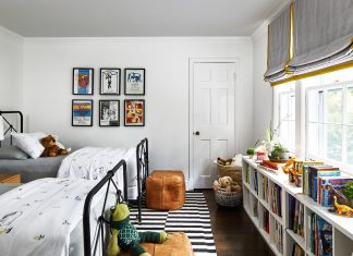 Kids room with two beds and book shelf