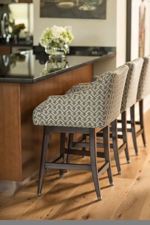 Bar chairs and bar with vase and flowers